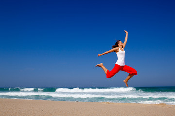 Wall Mural - young woman jumping