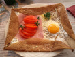 Close up of crep ,panacake with tomato and egg, crep