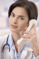 Wall Mural - Female doctor on the phone