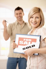 Poster - Happy couple buying new house