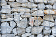 Stone wall in metal lattice