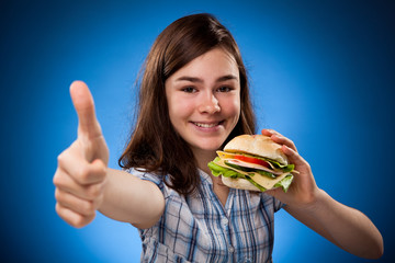 Wall Mural - Girl eating big sandwich