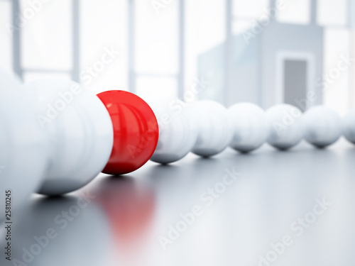 blurred white balls and red ball is in focus