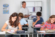 © goodluz - Group of students in classroom