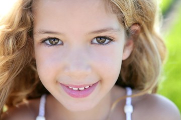 Wall Mural - beautiful little girl portrait smiling closeup