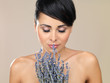 Portrait of beautiful woman, she holding bunch of lavender