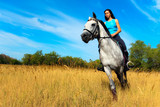 Fototapeta Konie - Girl on a horse