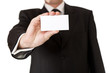 © mathom - Business man holding blank card on white isolated background
