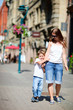 © TravelPhotoBloggers - Mother and son outdoors at city