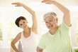 © nyul - Elderly woman with personal fitness trainer
