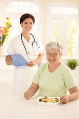 Wall Mural - Healthy elderly woman eating salad