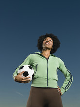 African Woman Holding Soccer Ball