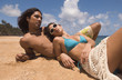 © PBNJ Productions/Blend Images - Couple laying on beach