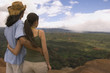 © PBNJ Productions/Blend Images - Couple hugging and looking out over landscape