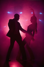 Boyfriend And Girlfriend Dancing At Nightclub