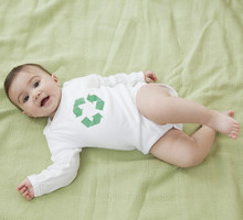Mixed Race Baby Girl With Recycling Symbol On Shirt