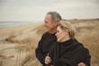 © John Henley/Blend Images - Caucasian couple standing on beach