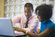 © Steve Prezant/Blend Images - African American businessman working with female co-worker