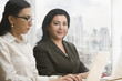 © REB Images/Blend Images - Businesswomen using laptops