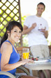 © Take A Pix Media/Blend Images - Couple eating breakfast on patio