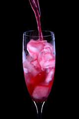 Wall Mural - red cocktail being poured into a glass