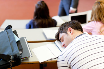 asleep male student during an university lesson