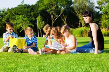 Wall Mural - Lovely preschoolers with books