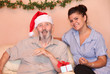 © godfer - xmas holidays elderly man with  carer or grandchild