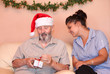 © godfer - christmas holiday senior with carer or grandchild