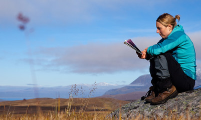 Wall Mural - female hiker with hikingmap