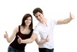 pleasant young couple - thumbs up (white background)