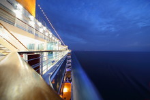 Big Illuminated Cruise Ship Riding In Evening. Wide Angle.