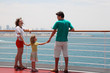 © Pavel Losevsky - family with daughter standing on cruise liner deck