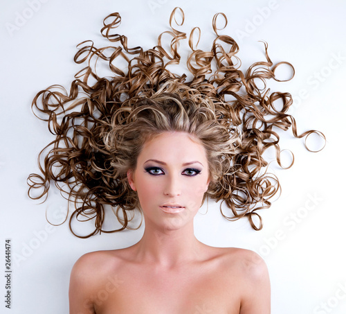 Naklejka na szybę Woman with blond beautiful long curly hair