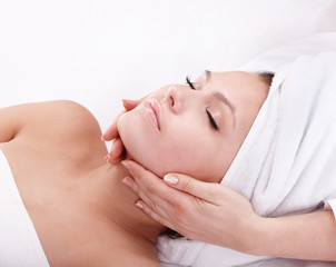 Young woman in spa. Facial massage.