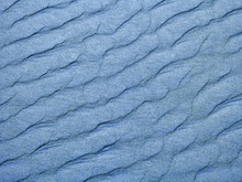 Abstract Background Of Blue Sand Ripples At The Beach