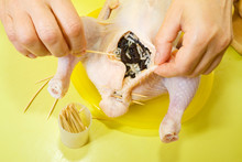 Cook Sewing Stuffed Chicken