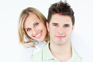 Portrait of a young happy couple against white background