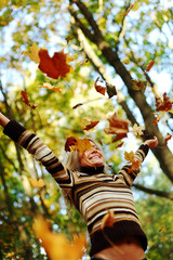 Wall Mural - woman drop leaves in autumn park