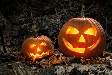 Halloween pumpkins on rocks  at night