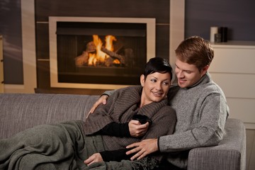 Couple hugging at home