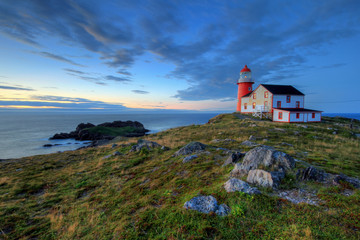 Rocky coastline with lighthouse.