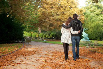 Young beautiful couple in the Luxembourg garden at fall. Paris,