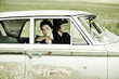 Young Couple in Old Car