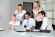 © goodluz - Group of business people meeting in the office