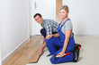 © goodluz - Closeup of artisan installing flooring in room