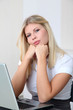 © goodluz - Bored businesswoman in front of computer