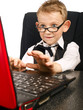 Kid in glasses on laptop