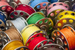 © pixelplot - Colorful spools of yarn in a close-up
