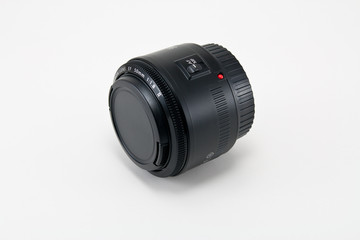 A 50mm camera lens isolated on white.